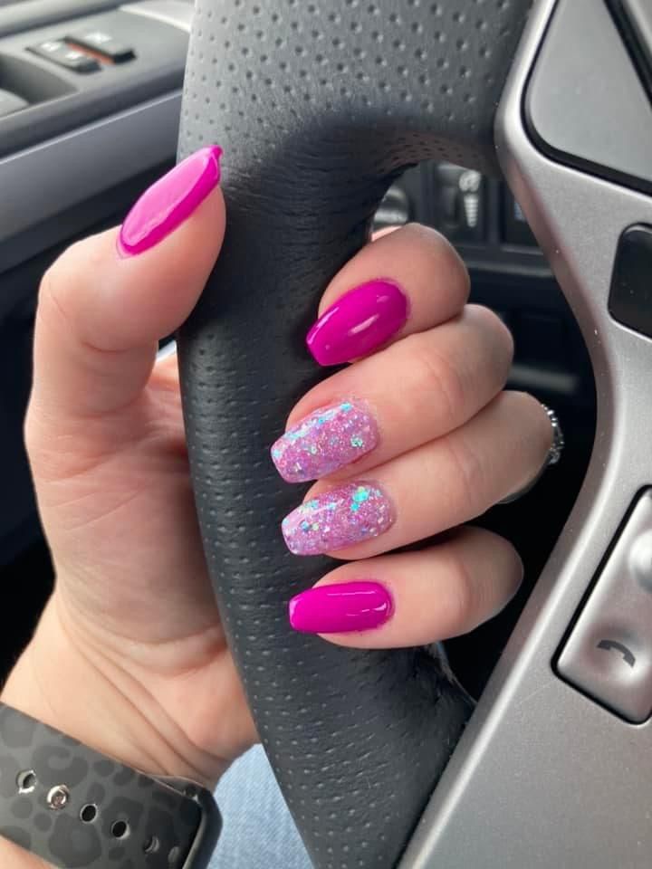 Sparkly glitter summer nails with a subtle shine, perfect for adding some glam to your look