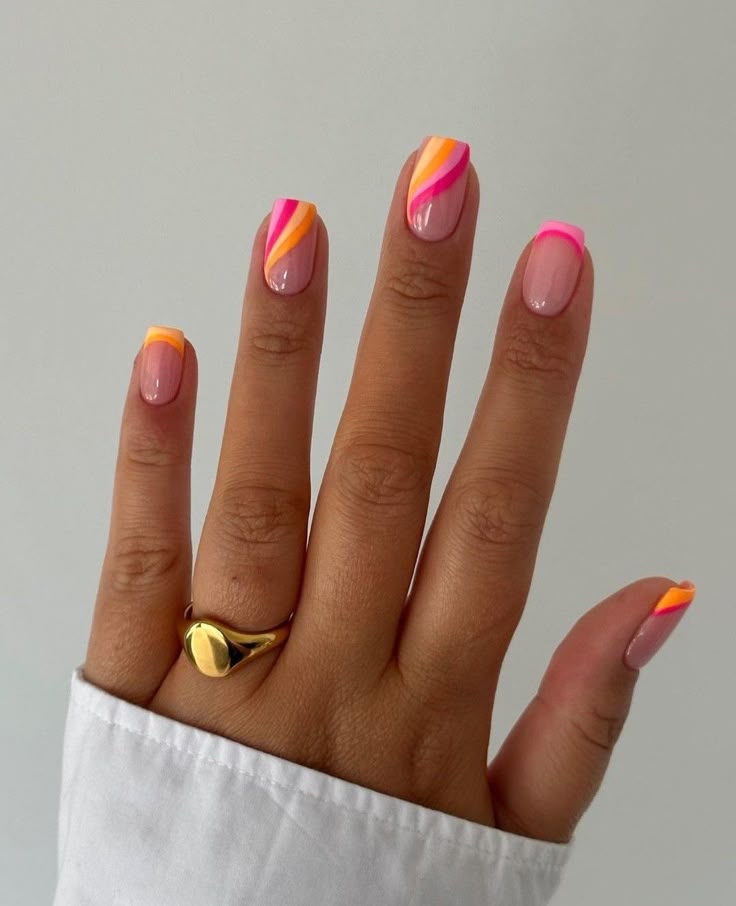 Vibrant neon French tips perfect for adding a bold pop of color to your summer style.