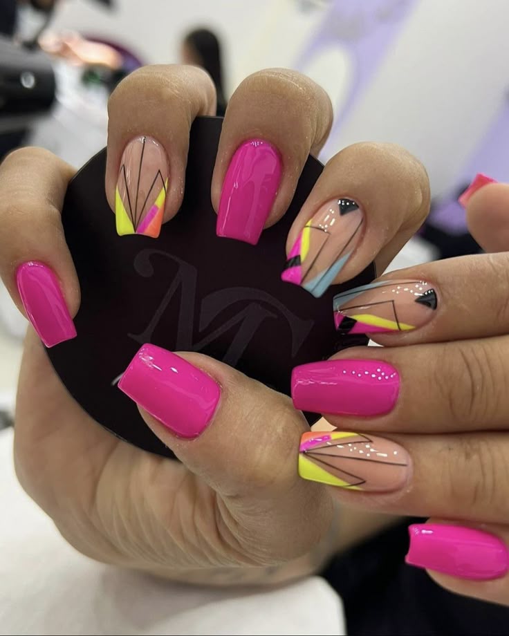 Vibrant neon geometric nails perfect for adding a bold pop of color to your summer style.