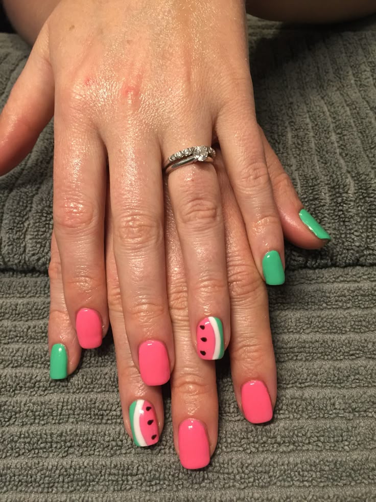 Colorful tropical fruit nail art featuring a watermelon design for a fun summer look.