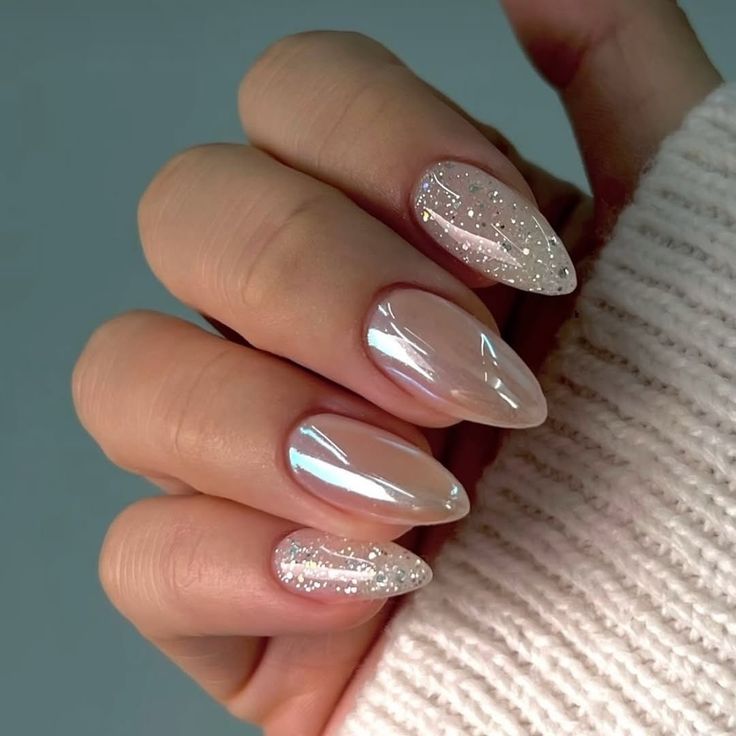 Chrome nails with glitter accents