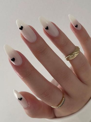 Black hearts on white nails