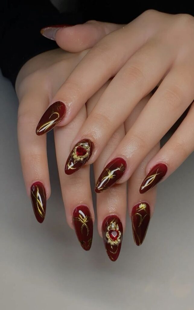 Luxe Gold Detailing to red nails