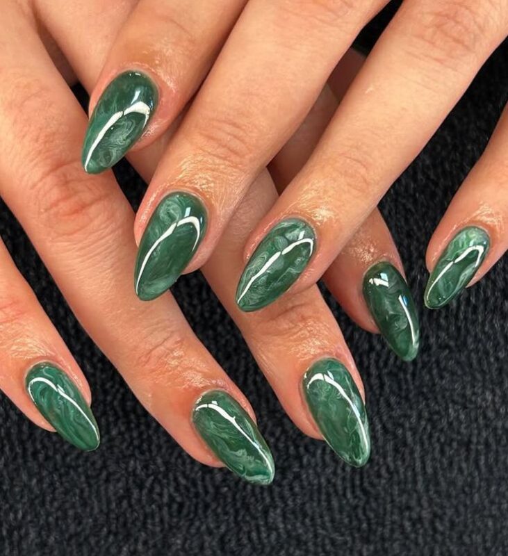 white and deep emerald on the nails 