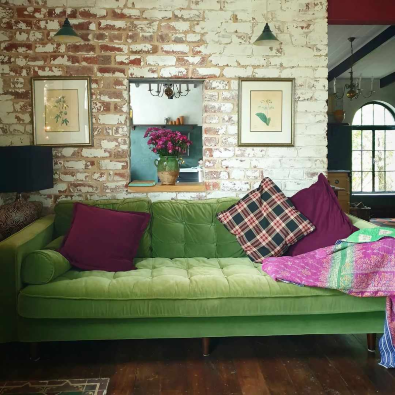  eclectic green couch with purple touches