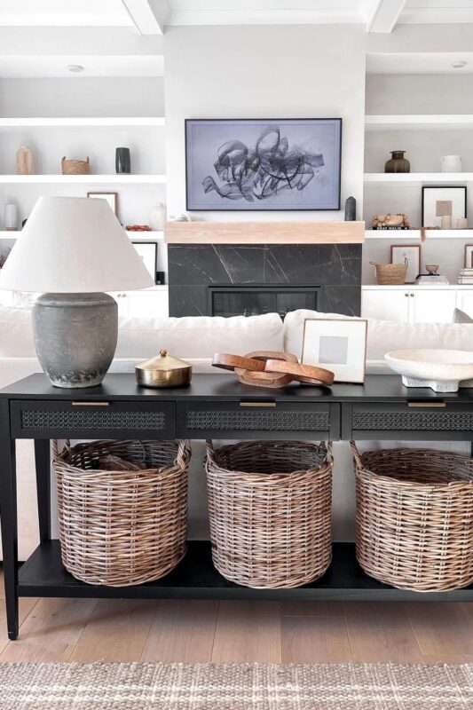 A black console table behind the couch