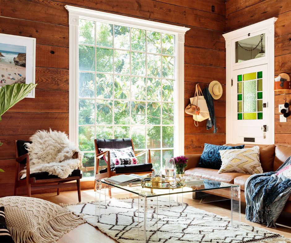 Wall paneling behind a brown couch