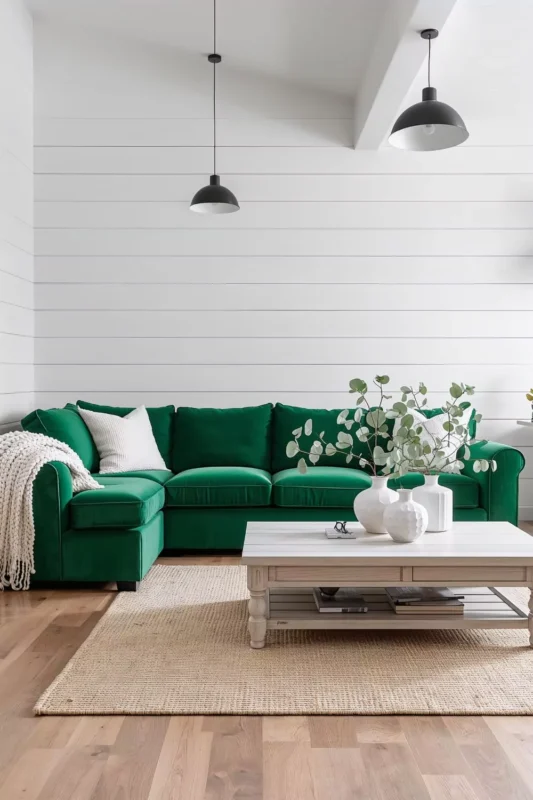 Emerald Green Sofa Against White Shiplap Walls